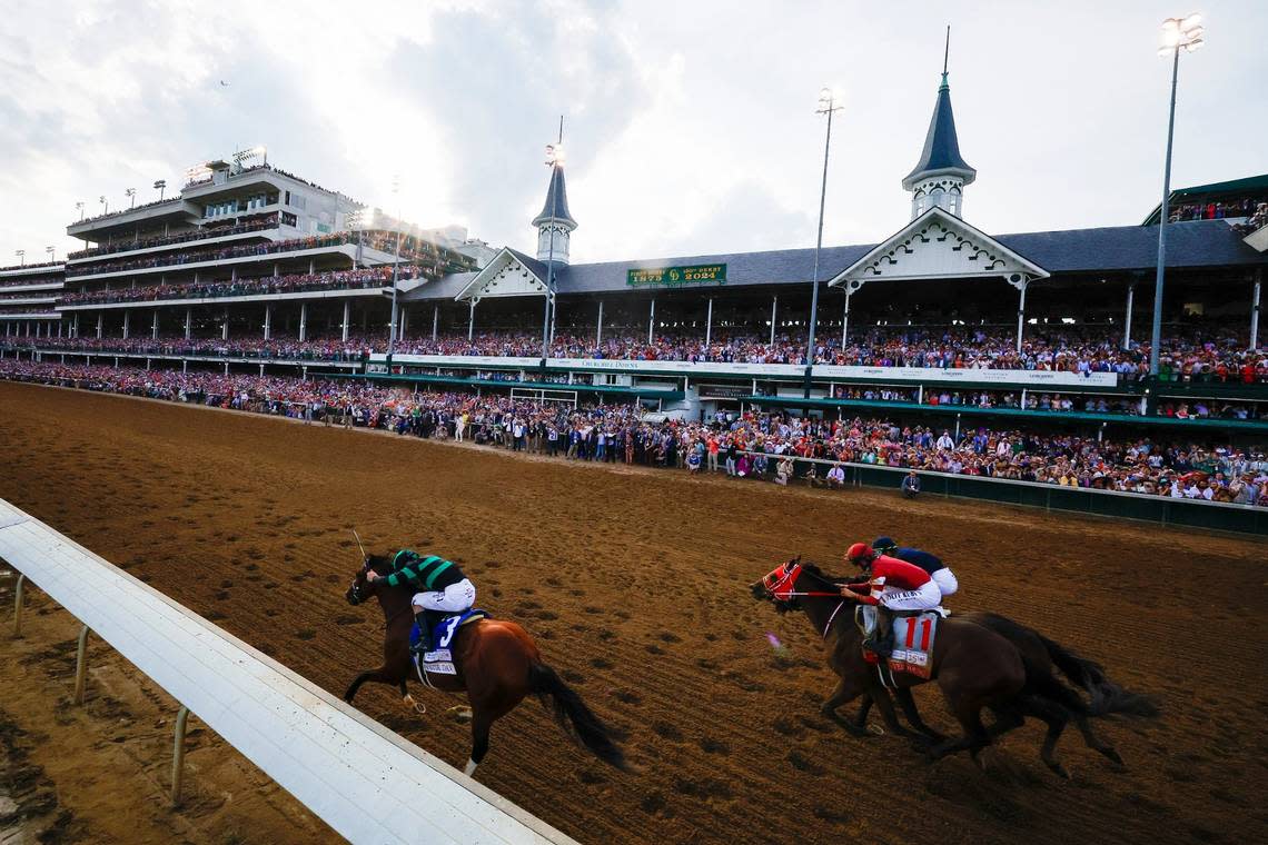 Brian Hernandez Jr. leads Mystik Dan (3) shortly before victory in the 150th running of the Kentucky Derby at Churchill Downs.