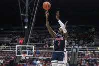 Arizona guard Caleb Love akes a 3-point shot against Stanford during the first half of an NCAA college basketball game, Sunday, Dec. 31, 2023, in Stanford, Calif. (AP Photo/Tony Avelar)