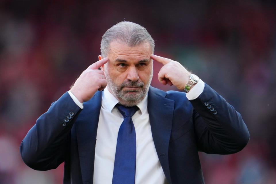 Tottenham’s head coach Ange Postecoglou gestures after defeat to Liverpool (AP)