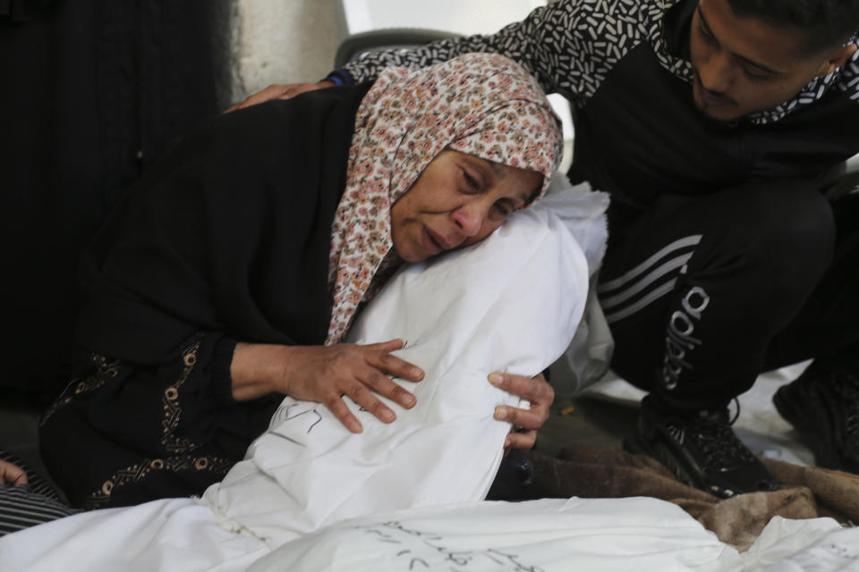 Palestinians mourn relatives killed in the Israeli bombardment on Rafah, Gaza Strip, Thursday, Dec. 7, 2023. AP Photo/Hatem Ali)