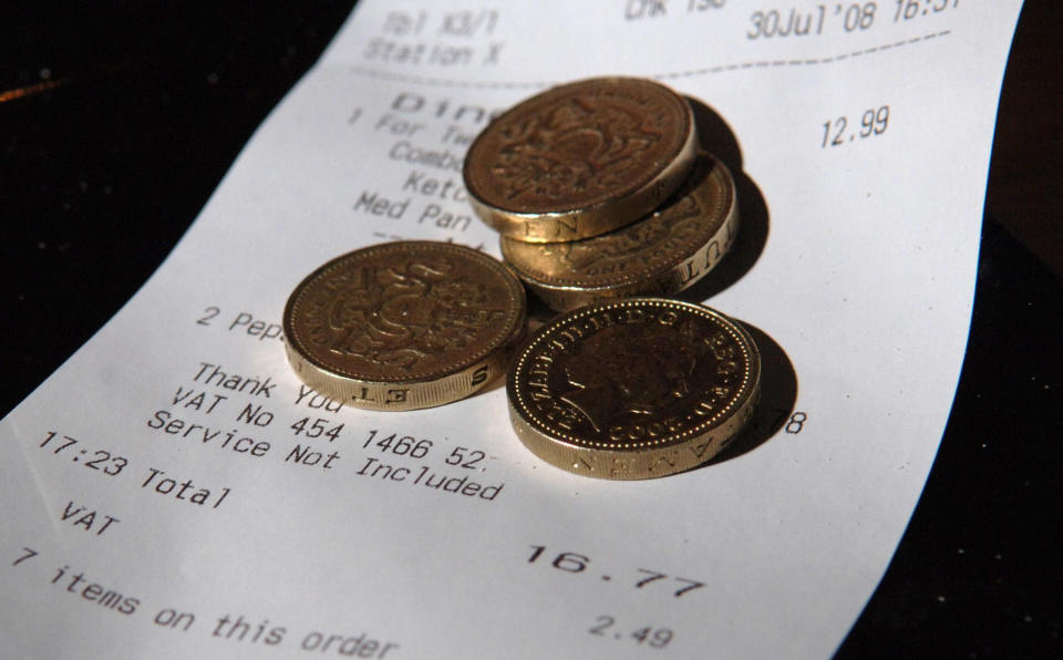 EMBARGOED TO 0001 THURSDAY JULY 31, 2008.    Money in a tray as tips in bars and restaurants will no longer be counted towards the pay of staff to bring them up to the minimum wage, the Government announced today. 