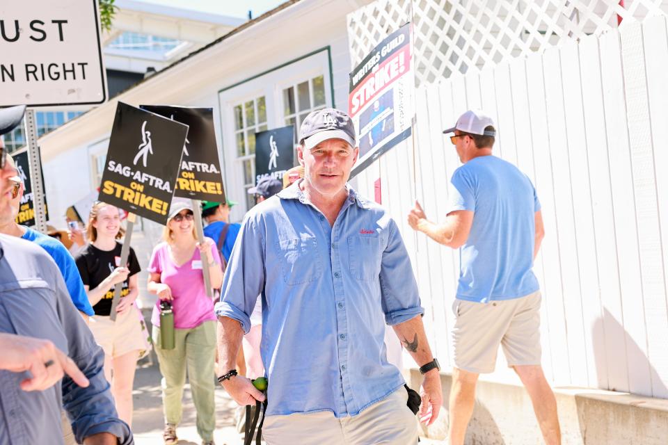 Clark Gregg speaks to members of the media at the SAG-AFTRA and WGA picket line on July 14, 2023 in Los Angeles, California.