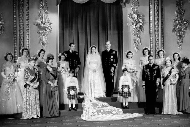 <p>Alamy</p> Queen Elizabeth and Prince Philip (center) pose for a photo on their Nov. 20, 1947 royal wedding day.