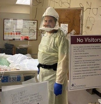 Matt Reed, RN, in a room at Holy Family Memorial Hospital amid the coronavirus pandemic.