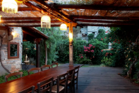 <p>Staff provide one meal a day for guests and can perform grocery shopping as needed. One of the outdoor dining areas is seen here. (Airbnb) </p>