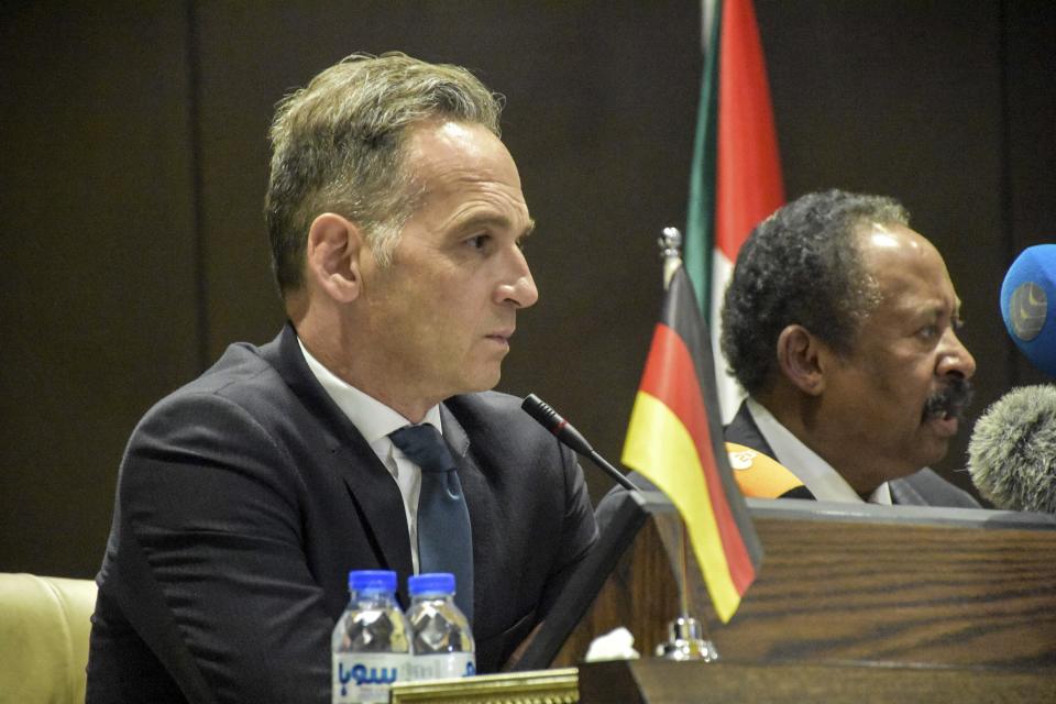 German Foreign Minister Heiko Maas, left, holds a press conference with Sudan's newly appointed Prime Minister Abdalla Hamdok, in Khartoum, Sudan, Tuesday, Sept. 3, 2019. Maas said Tuesday his country has been working to readmit Sudan into the international economy after the military's overthrow of autocratic President Omar al-Bashir in April amid mass protests against his 30-year rule. (AP Photo)