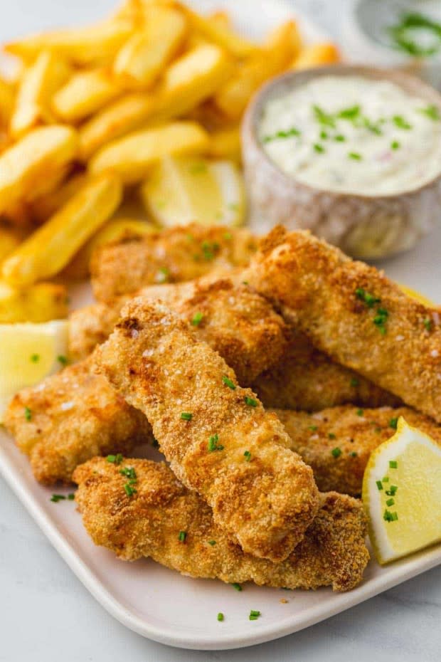 <p>Little Sunny Kitchen</p><p>These air fryer fish sticks are made in just 25 minutes from start to finish! They’re so easy to make, much healthier than deep-fried fish sticks and the kids love them!</p><p><strong>Get the recipe: <a href="https://littlesunnykitchen.com/air-fryer-fish-sticks/" rel="nofollow noopener" target="_blank" data-ylk="slk:Air Fryer Fish Sticks;elm:context_link;itc:0;sec:content-canvas" class="link ">Air Fryer Fish Sticks</a></strong></p>