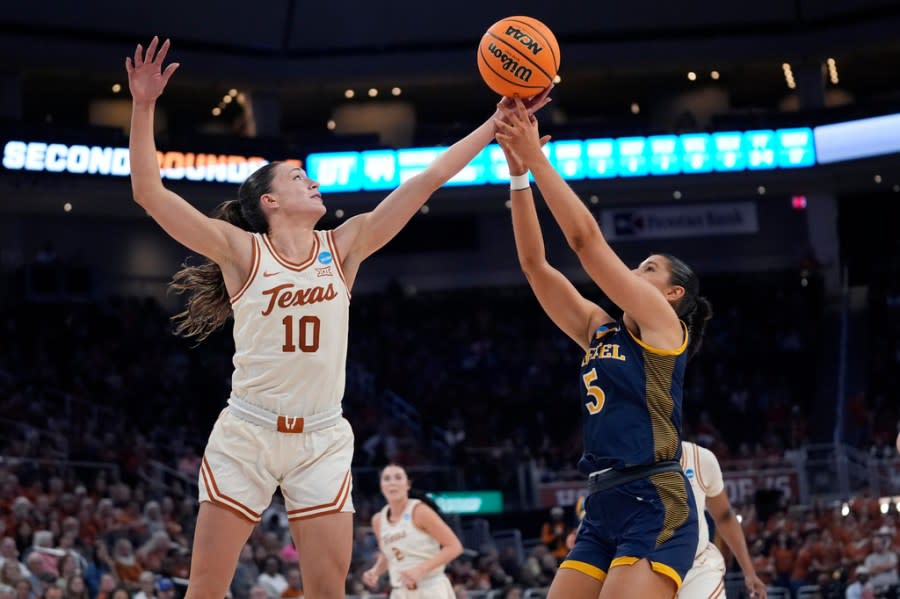 Texas guard Shay Holle (10) grabs a rebound over Drexel forward Chloe Hodges (5) during the second half of a first-round college basketball game in the women’s NCAA Tournament in Austin, Texas, Friday, March 22, 2024. (AP Photo/Eric Gay)