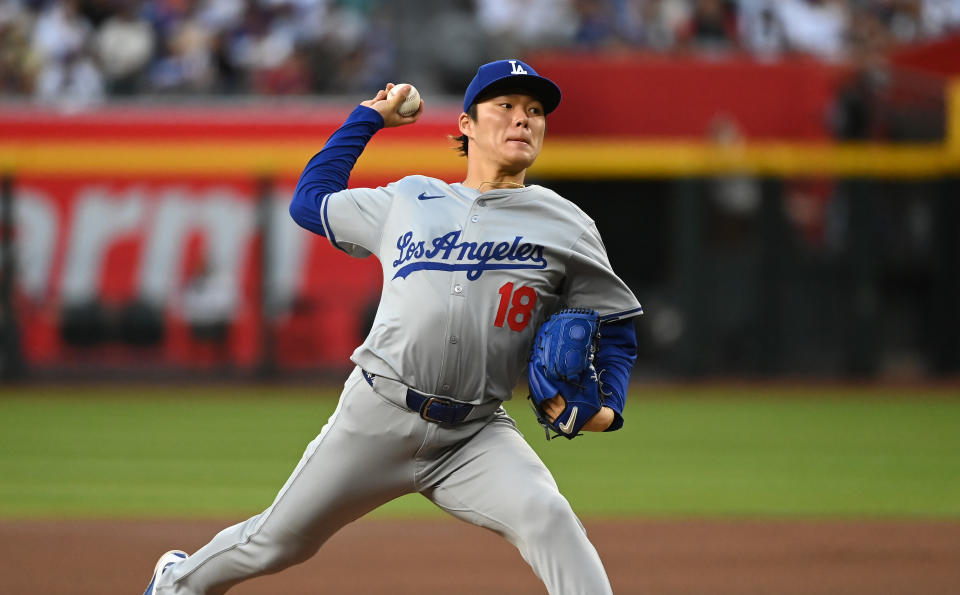 PHOENIX, ARIZONA - MAY 01: Yoshinobu Yamamoto #18 of the Los Angeles Dodgers delivers a first inning pitch against the Arizona Diamondbacks at Chase Field on May 01, 2024 in Phoenix, Arizona. (Photo by Norm Hall/Getty Images)