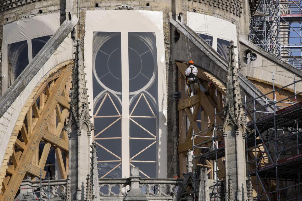 Workers are pictured during preliminary work to repair the fire damage at the Notre-Dame de Paris Cathedral, in Paris, France, Wednesday, July 24, 2019. (AP Photo/Rafael Yaghobzadeh, Pool)