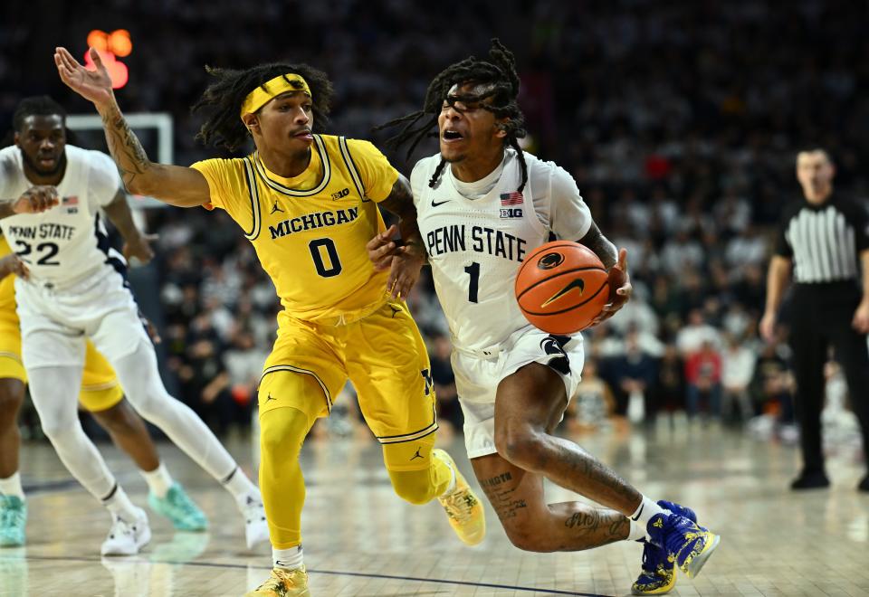 Jan 7, 2024; Philadelphia, Pennsylvania, USA; Michigan Wolverines guard Dug McDaniel (0) defends Penn State Nittany Lions guard Ace Baldwin Jr (1) in the first half at The Palestra. Mandatory Credit: Kyle Ross-USA TODAY Sports