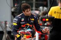 Formula One - F1 - Australian Grand Prix - Melbourne, Australia - 25/03/2017 Red Bull Racing driver Daniel Ricciardo of Australia reacts as he walks down pit lane after crashing out of the qualifying session. REUTERS/Brandon Malone