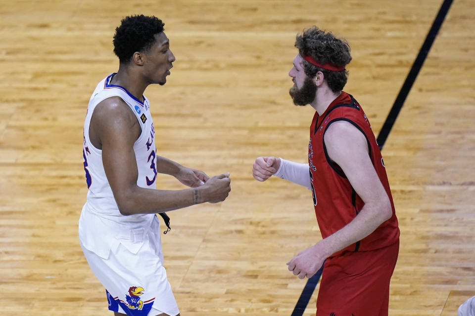 Kansas forward David McCormack (33) greetsEastern Washington forward Tanner Groves (35) after Kansas won a first-round game in the NCAA college basketball tournament at Farmers Coliseum in Indianapolis, Saturday, March 20, 2021. (AP Photo/AJ Mast)