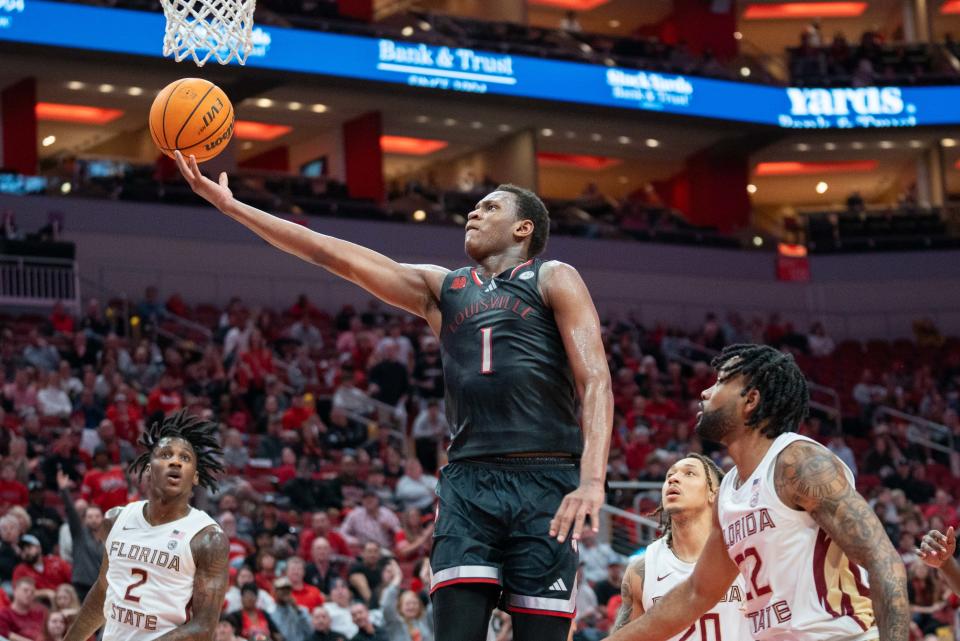 Louisville Cardinals guard Curtis Williams (1) goes for a layup during their game against the Florida State Seminoles on Saturday, Feb. 3, 2024 at KFC YUM Center.