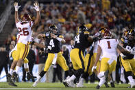 Southern California safety Talanoa Hufanga (15) knocks the ball out of the hands of Iowa quarterback Nate Stanley (4) who was attempting to throw a pass during the first half of the Holiday Bowl NCAA college football game Friday, Dec. 27, 2019, in San Diego. (AP Photo/Orlando Ramirez)