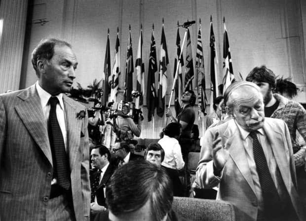 Quebec Premier Rene Levesque (R) shrugs his shoulders and walks away from Prime Minister Pierre Trudeau (L) after a chat prior to the beginning of the second day of the Constitution Conference Sept 9, 1980. Petitioners want Montreal's airport to be renamed after Levesque.