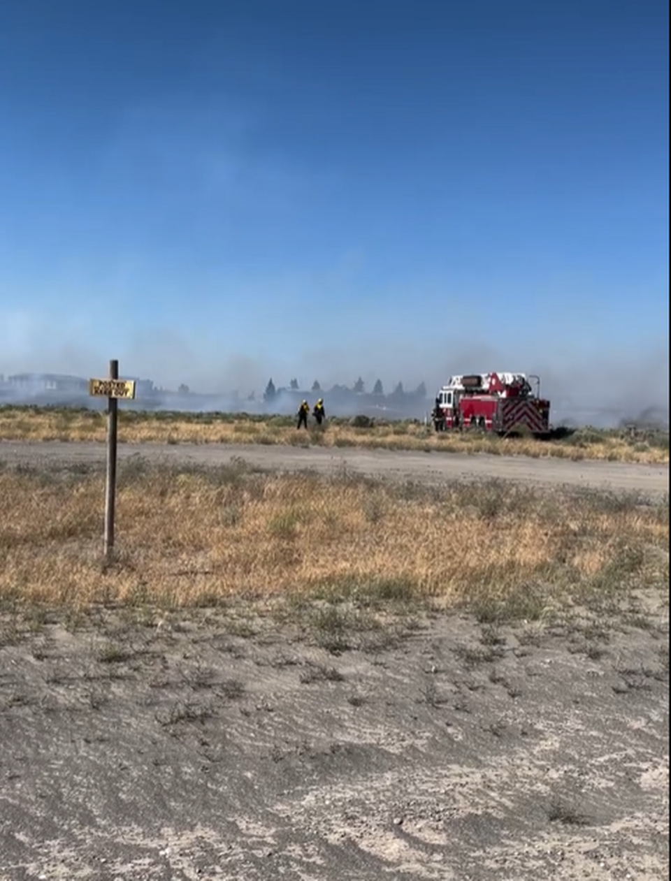 Pasco firefighters are battling a brush fire near Interstate 182 and Road 68. The fire started near the exit.