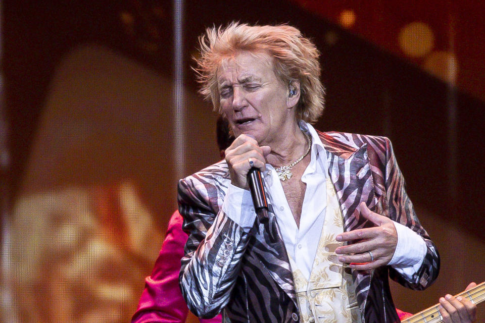 Rod Stewart performing on stage