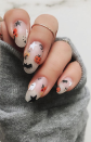 <p><a href="https://www.instagram.com/p/B4K2-IVjCdQ/" rel="nofollow noopener" target="_blank" data-ylk="slk:Nail artist Nina Park;elm:context_link;itc:0;sec:content-canvas" class="link ">Nail artist Nina Park</a> adds in little floral accents to her pumpkin, bats, and ghost-adorned mani for a cute take on the Halloween theme.</p><p><a class="link " href="https://go.redirectingat.com?id=74968X1596630&url=https%3A%2F%2Fwww.etsy.com%2Flisting%2F873290255%2Fhalloween-cemetery-death-graveyard&sref=https%3A%2F%2Fwww.oprahdaily.com%2Fbeauty%2Fskin-makeup%2Fg33239588%2Fhalloween-nail-ideas%2F" rel="nofollow noopener" target="_blank" data-ylk="slk:SHOP NAIL DECALS;elm:context_link;itc:0;sec:content-canvas">SHOP NAIL DECALS</a></p>