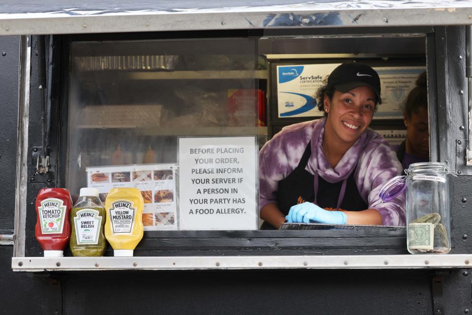 Justine Ramos, co-owner of Cheesy Chicks food truck, is ready to serve customers outside Abington Town Hall on Saturday, May 7, 2022.