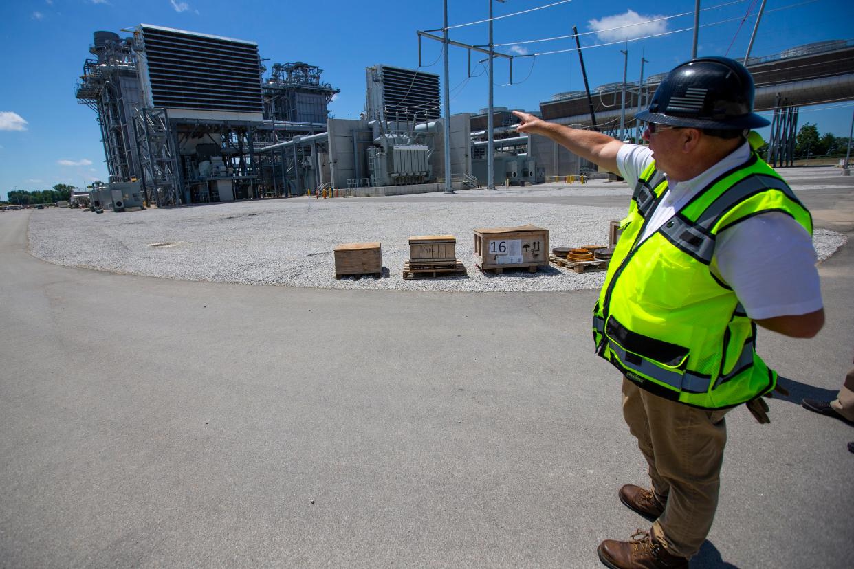 Plant Manager Kevin Beavers points to a gas turbine Tuesday at the Indeck Niles Energy Center. The $1.1 billion plant is now operating at full capacity.