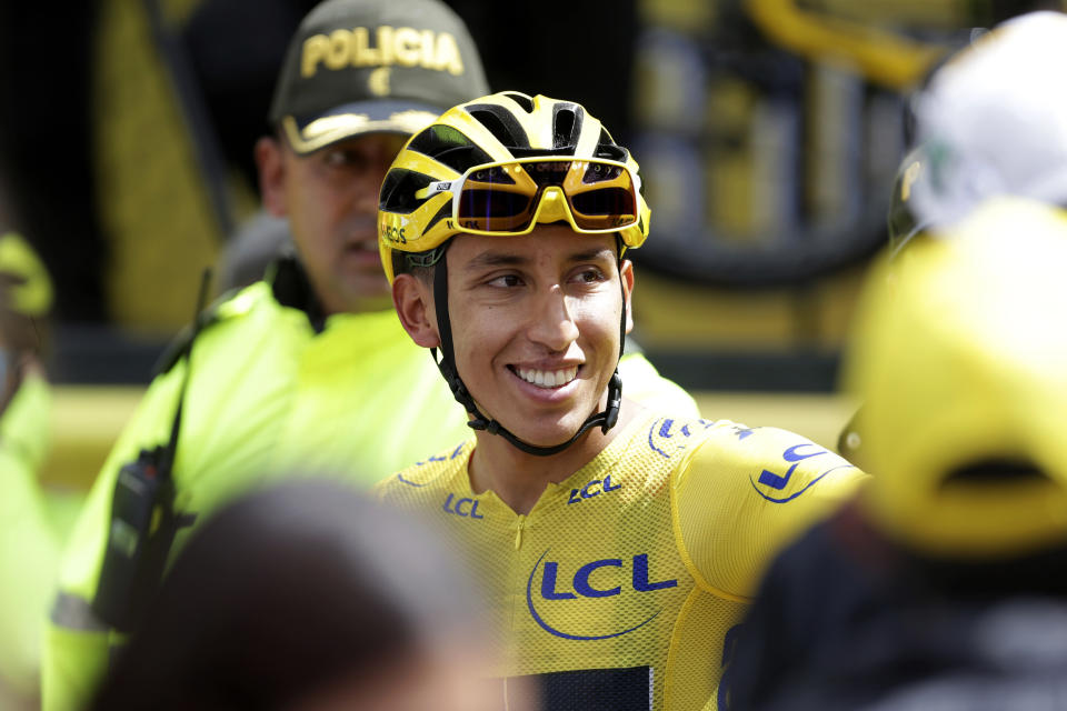 Tour de France winner Egan Bernal smiles as he is welcomed home to Zipaquira, Colombia, Wednesday, Aug. 7, 2019. Bernal rode into the town's central square on his bike on wearing the Tour de France's iconic yellow jersey. A group of some 3,000 supporters dressed in the same color chanted his name. (AP Photo/Ivan Valencia)