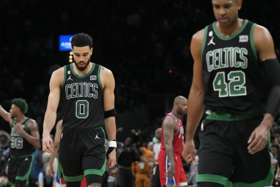 Boston Celtics forward Jayson Tatum (0) and center Al Horford, right, walk off the court following a loss to the Philadelphia 76ers in Game 1 of the NBA basketball Eastern Conference semifinals playoff series, Monday, May 1, 2023, in Boston. (AP Photo/Charles Krupa)