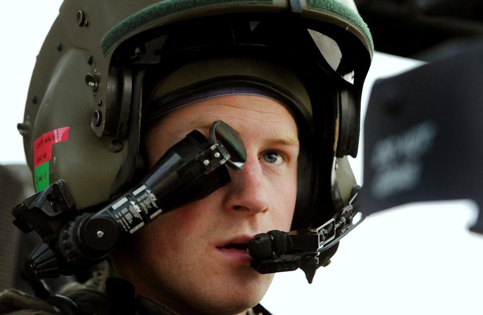 Britain's Prince Harry wears his monocle gun sight as he sits in his Apache helicopter in Camp Bastion, southern Afghanistan in this photograph taken December 12, 2012, and released January 21, 2013. The Prince, who is serving as a pilot/gunner with 662 Squadron Army Air Corps, is on a posting to Afghanistan that runs from September 2012  to January 2013.  Photograph taken December 12, 2012.     REUTERS/John Stillwell/Pool  (AFGHANISTAN - Tags: MILITARY POLITICS SOCIETY ROYALS CONFLICT)