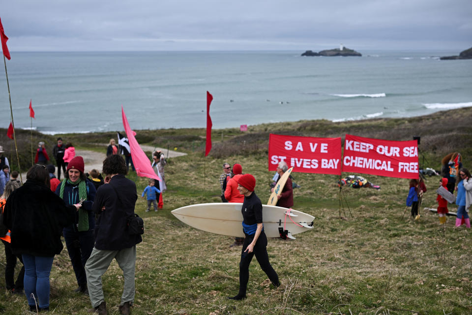 People attend a demonstration to stop chemical sewage dumps, at Gwithian Beach, St. Ives, Cornwall, Britain, April 16, 2023. REUTERS/Dylan Martinez