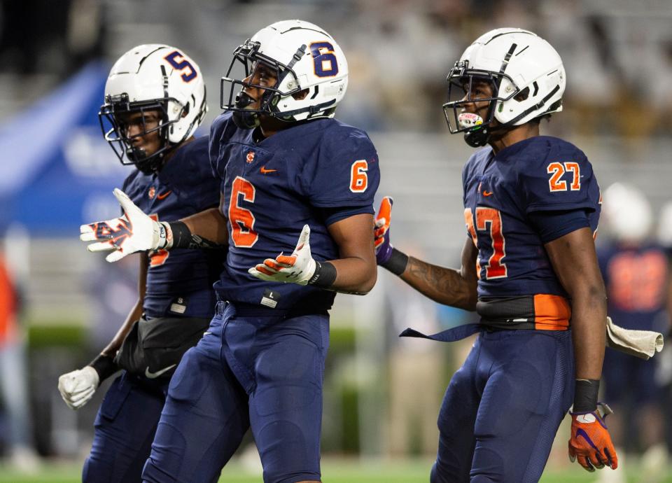 Charles Henderson's Zion Grady (6) celebrates a stop during the AHSAA Super 7 football Class 5A state championship at Jordan-Hare Stadium in Auburn, Ala., on Thursday, Dec. 1, 2022. Ramsay leads Charles Henderson 20-13. Syndication: The Montgomery Advertiser