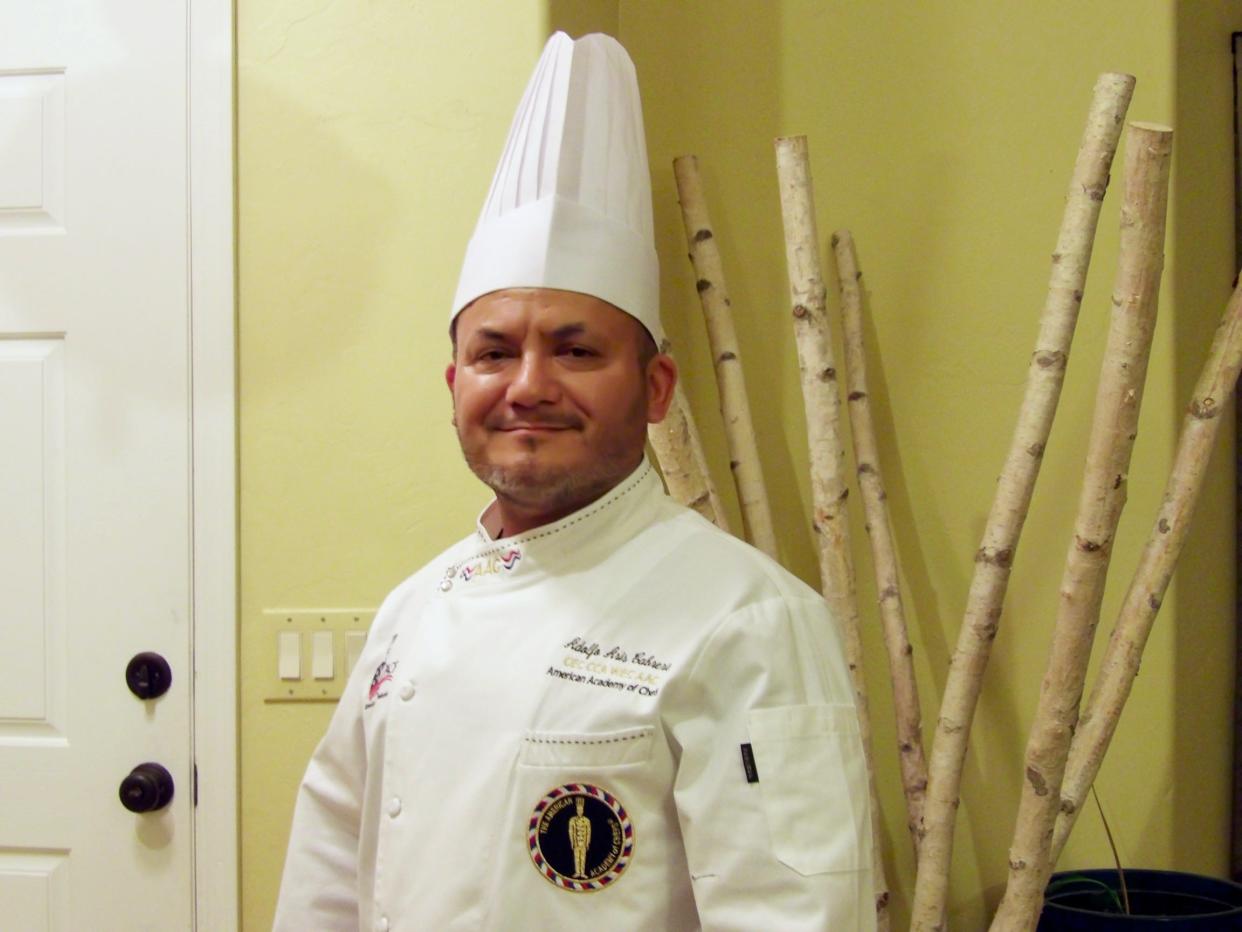 Chef Cabrera tries on his American Academy of Chefs jacket.