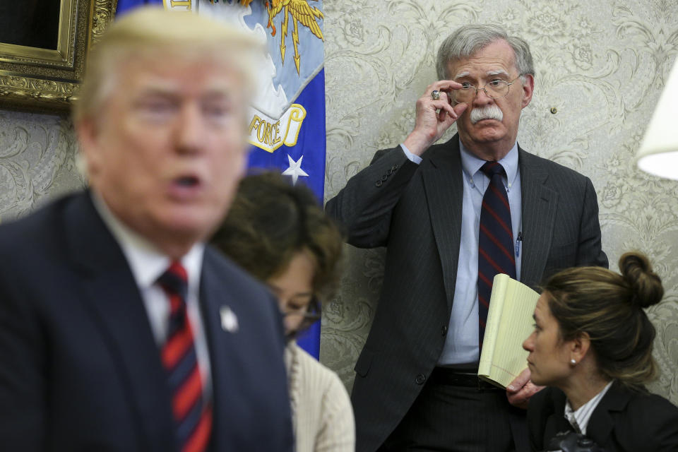 President Trump speaks as national security advisor John Bolton listens during in the Oval Office of the White House, May 22, 2018. (Oliver Contreras-Pool/Getty Images)