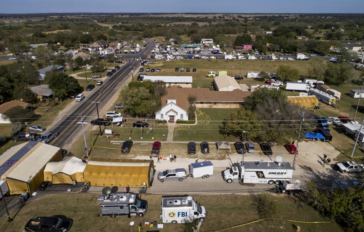 Investigators work at the First Baptist Church in Sutherland Springs, Texas, on Nov. 6, 2017, the day after over 20 people died in a mass shooting. (Jay Janner / Austin American-Statesman via AP file)