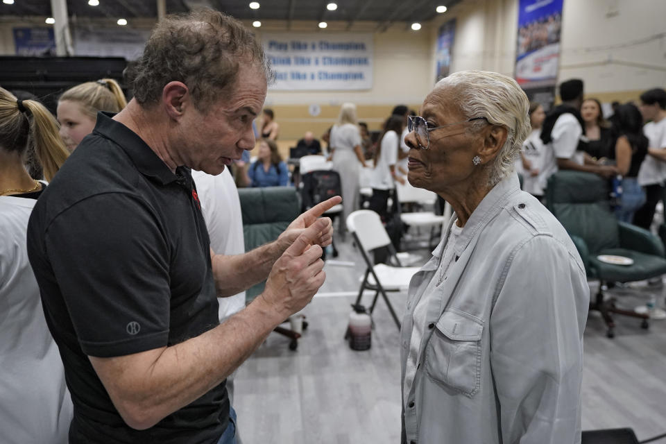 Executive producer Bob Gries, left, talks to singing legend Dionne Warwick during a rehearsal for the touring show "Hits! The Musical" Wednesday, Feb. 8, 2023, in Clearwater, Fla. Warwick and her Oscar-nominated son Damon Elliott are co-producing the upcoming 50-city touring show. AP Photo/Chris O'Meara)