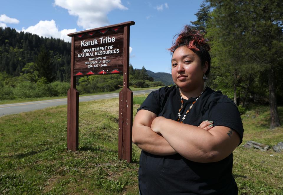 Vikki Preston, a cultural resources technician for the Karuk Tribe, stands outside the tribe's Department of Natural Resources office in Orleans, Calif., on May 9, 2023. Preston is worried about the environmental impacts of illegal marijuana grows on the tribe's ancestral lands.