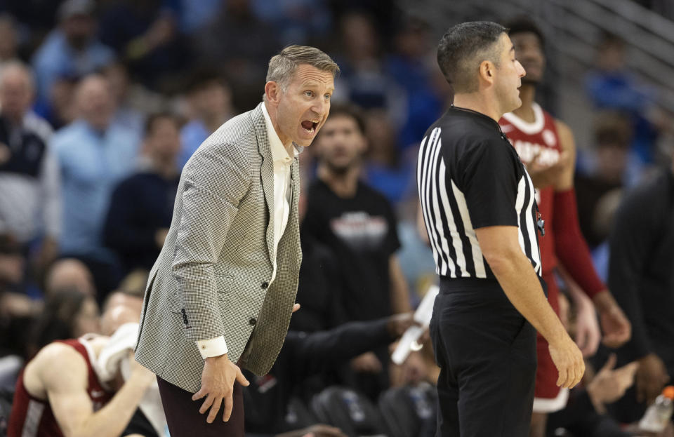 Alabama head coach Nate Oats, left, protests a foul called against his team during the first half of an NCAA college basketball game against Creighton, Saturday, Dec. 16, 2023, in Omaha, Neb. (AP Photo/Rebecca S. Gratz)