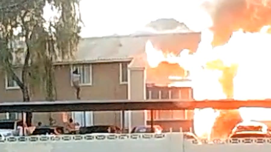 <em>A dramatic video 8 News Now obtained captures a person dangling out of the second-floor window of an apartment building that was on fire. (KLAS)</em><br> <br>The fire happened on Sunday night at in the 3900 block of Spencer Street at the Riverbend Village Apartments near Flamingo Road.