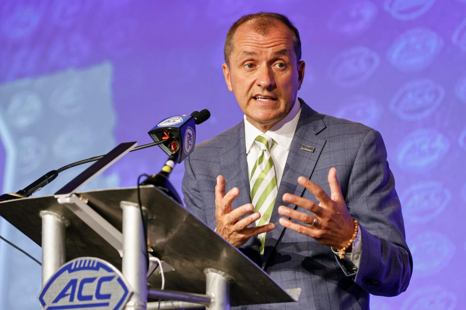Atlantic Coast Conference commissioner Jim Phillips answers a question during an NCAA college football news conference at the ACC media days in Charlotte, N.C., Wednesday, July 20, 2022. (AP Photo/Nell Redmond)