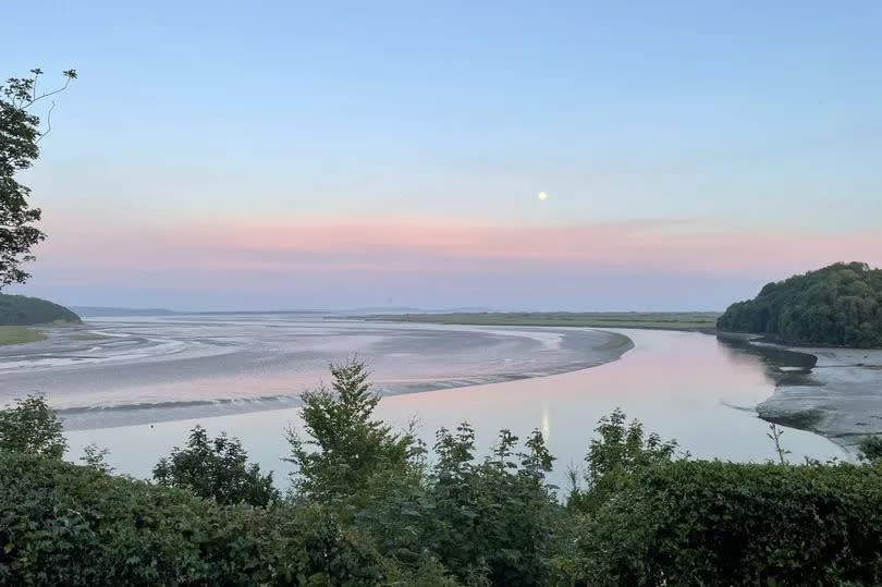 Sunset view over bay with hills