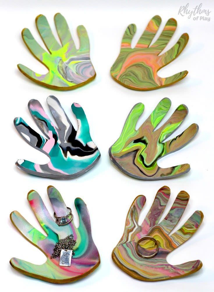<p>Need a new way to memorialize your kids' hands? This pretty jewelry tray in the shape of her kids' handprint is sure to make mom shed a tear (in a good way!) </p><p><em><a href="https://rhythmsofplay.com/marbled-clay-jewelry-dish-keepsake-craft-and-gift/" rel="nofollow noopener" target="_blank" data-ylk="slk:Get the tutorial at Rhythms of Play »;elm:context_link;itc:0;sec:content-canvas" class="link ">Get the tutorial at Rhythms of Play »</a></em> <br></p>