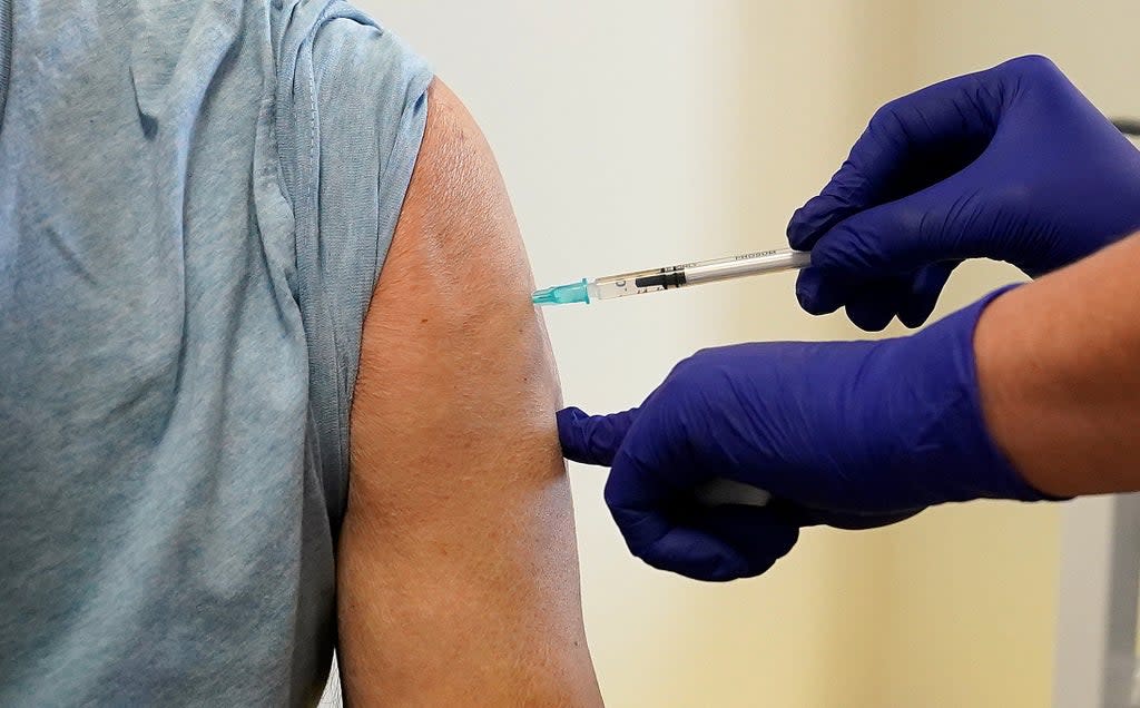 A patient receives a Covid-19 vaccine booster (Martin Rickett/PA) (PA Wire)