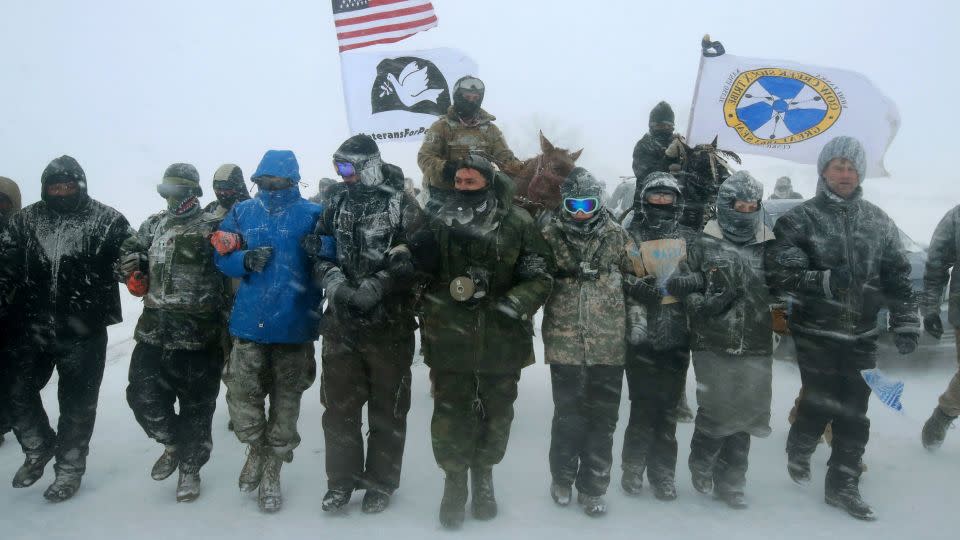 Military veterans march through blizzard conditions to support "water protectors" at the Oceti Sakowin Camp on the Standing Rock Sioux Reservation on December 5, 2016. - Scott Olson/Getty Images