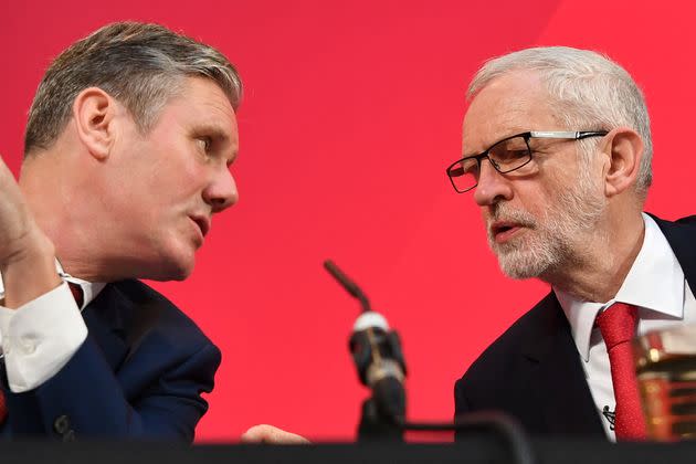 Then-Labour party leader Jeremy Corbyn, right, speaks with his then-shadow Brexit secretary Keir Starmer during a news conference in London on Dec. 6, 2019.