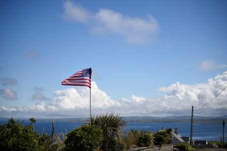 A U.S. flag flies overlooking the coastline where U.S. President Donald Trump's Doonbeg Golf course is located during his visit in the County Clare village of Doonbeg