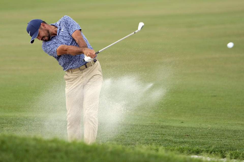 Jason Day hits a shot from a sand trap on the first fairway during final round of the Arnold Palmer Invitational golf tournament Sunday, March 5, 2023, in Orlando, Fla. (AP Photo/John Raoux)