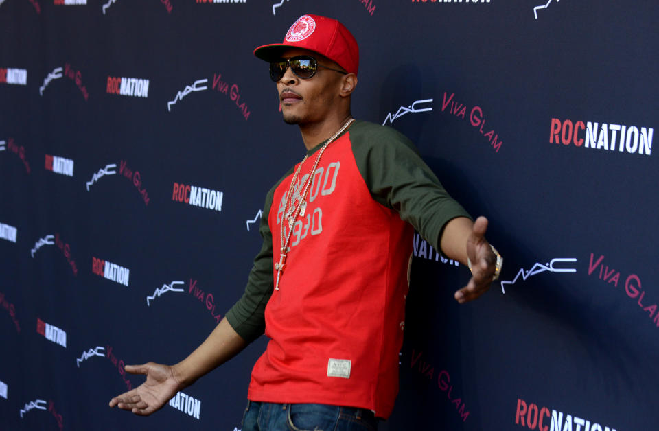 T.I. arrives at the Roc Nation 2014 Pre-Grammy Brunch Celebration on Saturday, Jan. 25, 2014 in Los Angeles. (Photo by Jordan Strauss/Invision/AP)