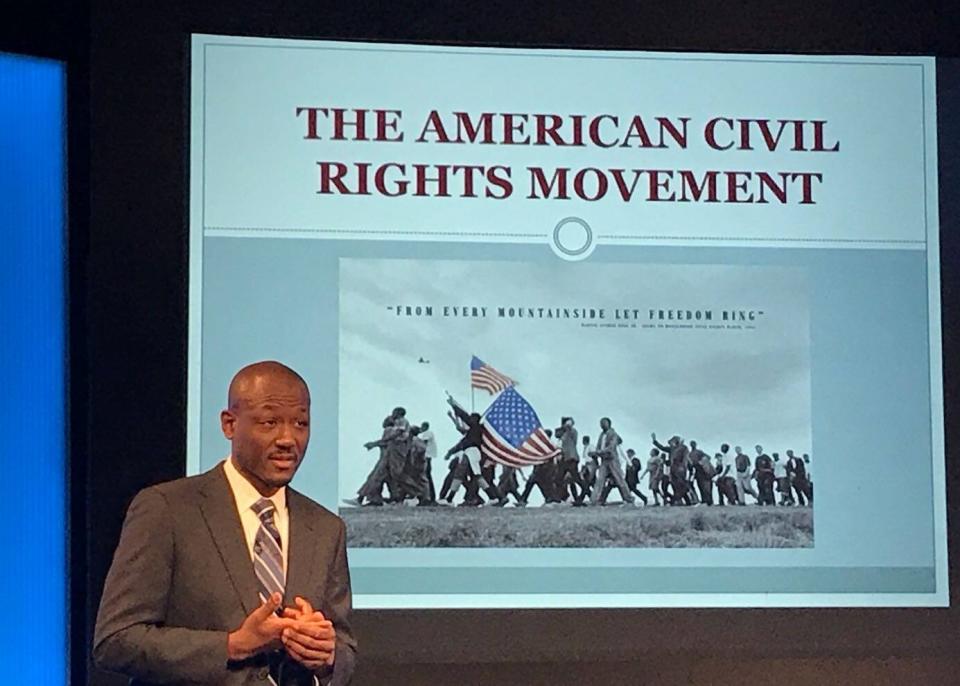 Chris Richardson giving a presentation on Black History Month in Madrid in 2018. Like many well-regarded diplomats, he left the department during President Donald Trump's administration. (Photo: Courtesy Chris Richardson)