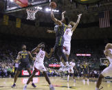 Baylor guard Keyonte George (1) score over Arkansas guard Anthony Black (0) in the first half of an NCAA college basketball game, Saturday, Jan. 28, 2023, in Waco, Texas. (Rod Aydelotte/Waco Tribune-Herald via AP)