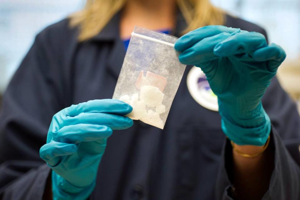 In this Aug. 9, 2016, file photo, a bag of 4-fluoro isobutyryl fentanyl which was seized in a drug raid is displayed at the Drug Enforcement Administration (DEA) Special Testing and Research Laboratory in Sterling, Va. Acting United States DEA administrator Chuck Rosenberg will visit China next week amid efforts to cut off the Chinese supply of deadly synthetic drugs, like fentanyl. China disputes U.S. claims that it’s the top source of opioids. Still, Beijing has already banned fentanyl, an opioid some 50 times stronger than heroin, and 18 related compounds. 