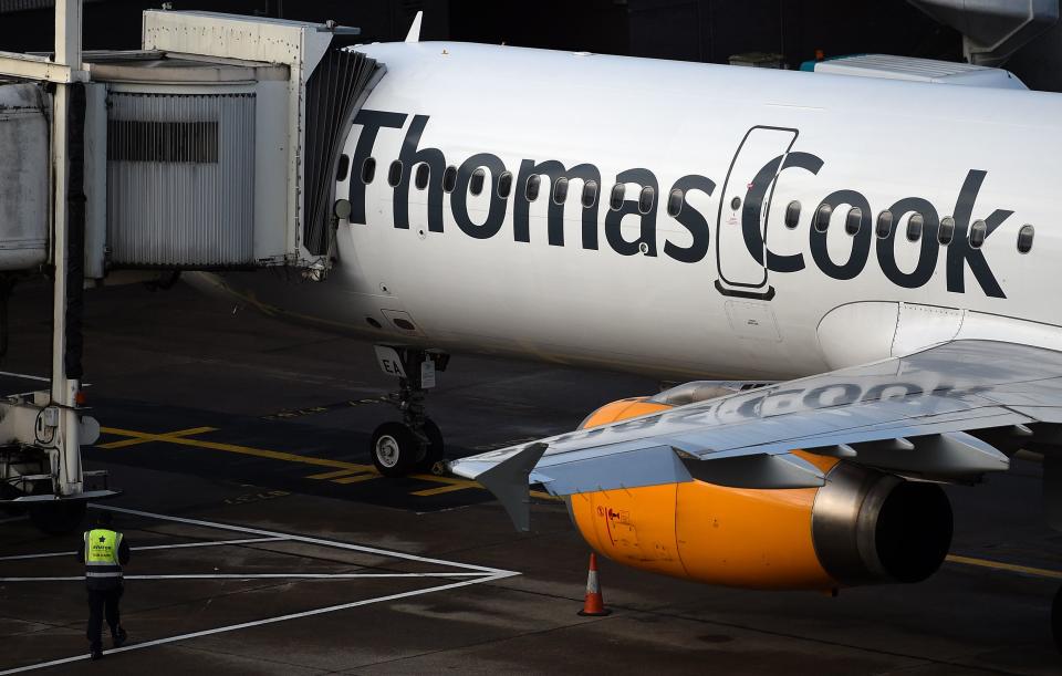 A Thomas Cook passenger aircraft stands on the tarmac at Manchester Airport in Manchester, northern England on Septmeber 23, 2019, after the company announced it was taking steps to enter into compulsory liquidation with immediate effect. - British travel group Thomas Cook on Monday declared bankruptcy after failing to reach a last-ditch rescue deal, triggering the UK's biggest repatriation since World War II to bring back tens of thousands of stranded passengers. The 178-year-old operator, which had struggled against fierce online competition for some time and which had blamed Brexit uncertainty for a recent drop in bookings, was desperately seeking £200 million ($250 million, 227 million euros) from private investors to avert collapse. (Photo by Oli SCARFF / AFP)        (Photo credit should read OLI SCARFF/AFP/Getty Images)